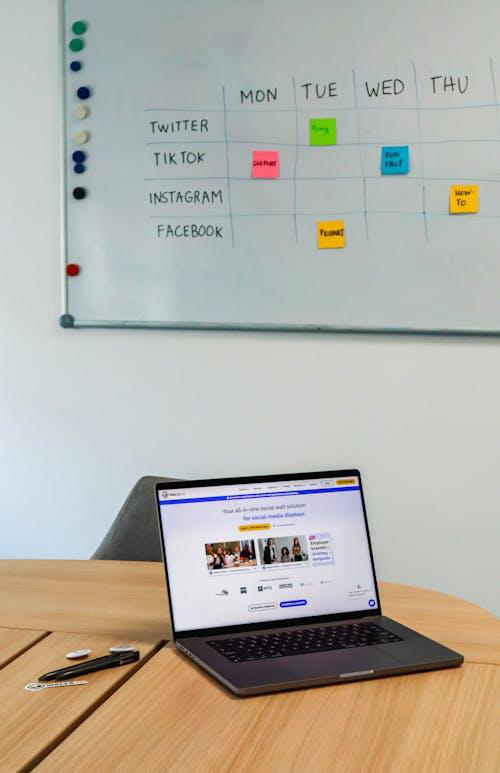 Professional setting up a digital media campaign on screen