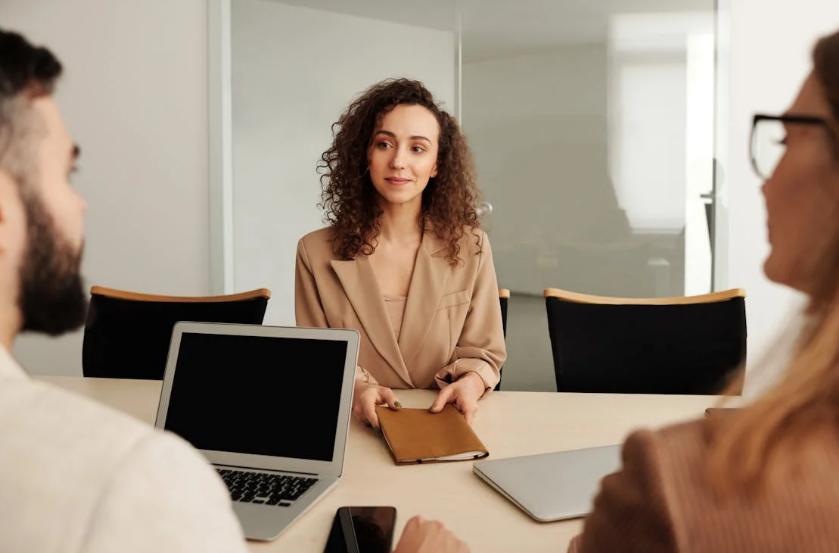 a meeting between PR specialists and business owners