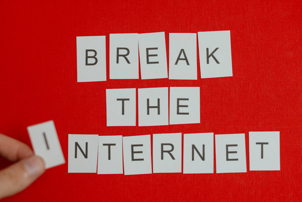 break the internet phrase in cut out letters on red background