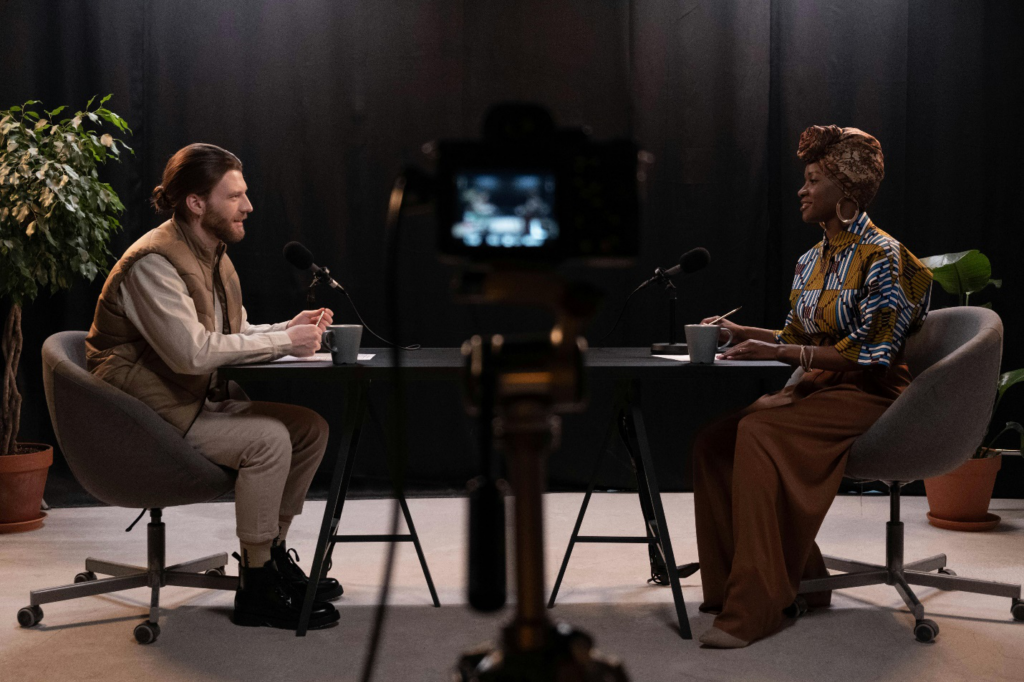 a man interviewing a woman