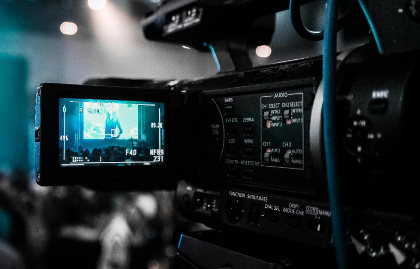 A close-up shot of a professional video camera.