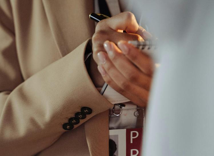 A press member taking a note