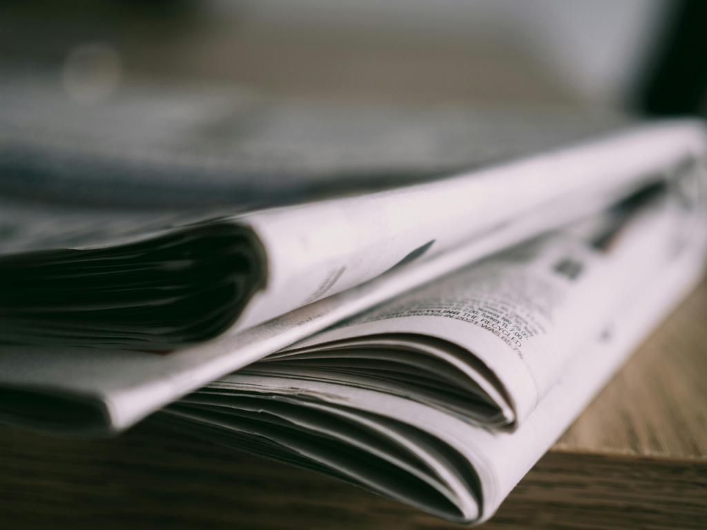 newspapers on a wooden table