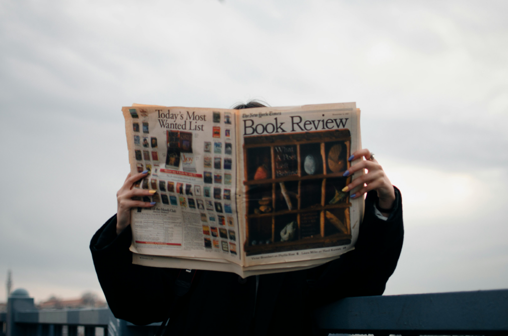 a person holding a newspaper