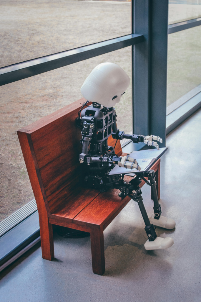 A robot sitting on a bench