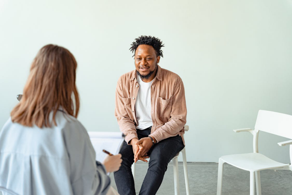 man in a psychotherapy session with a psychologist
