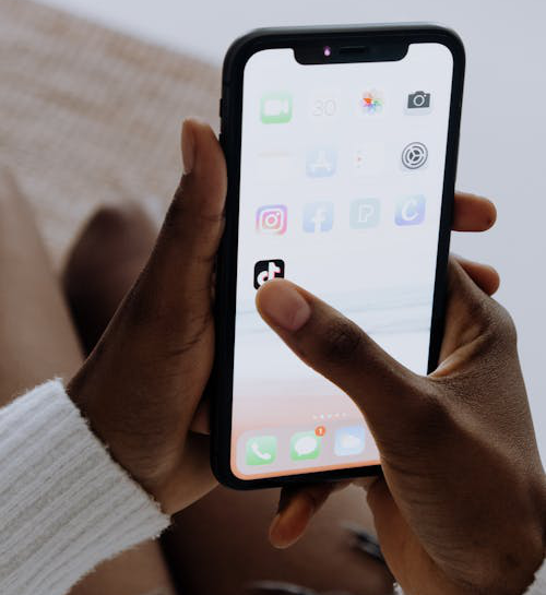 person holding black iphone 5