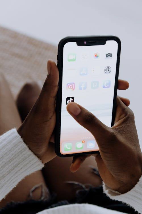 person holding black iphone 5